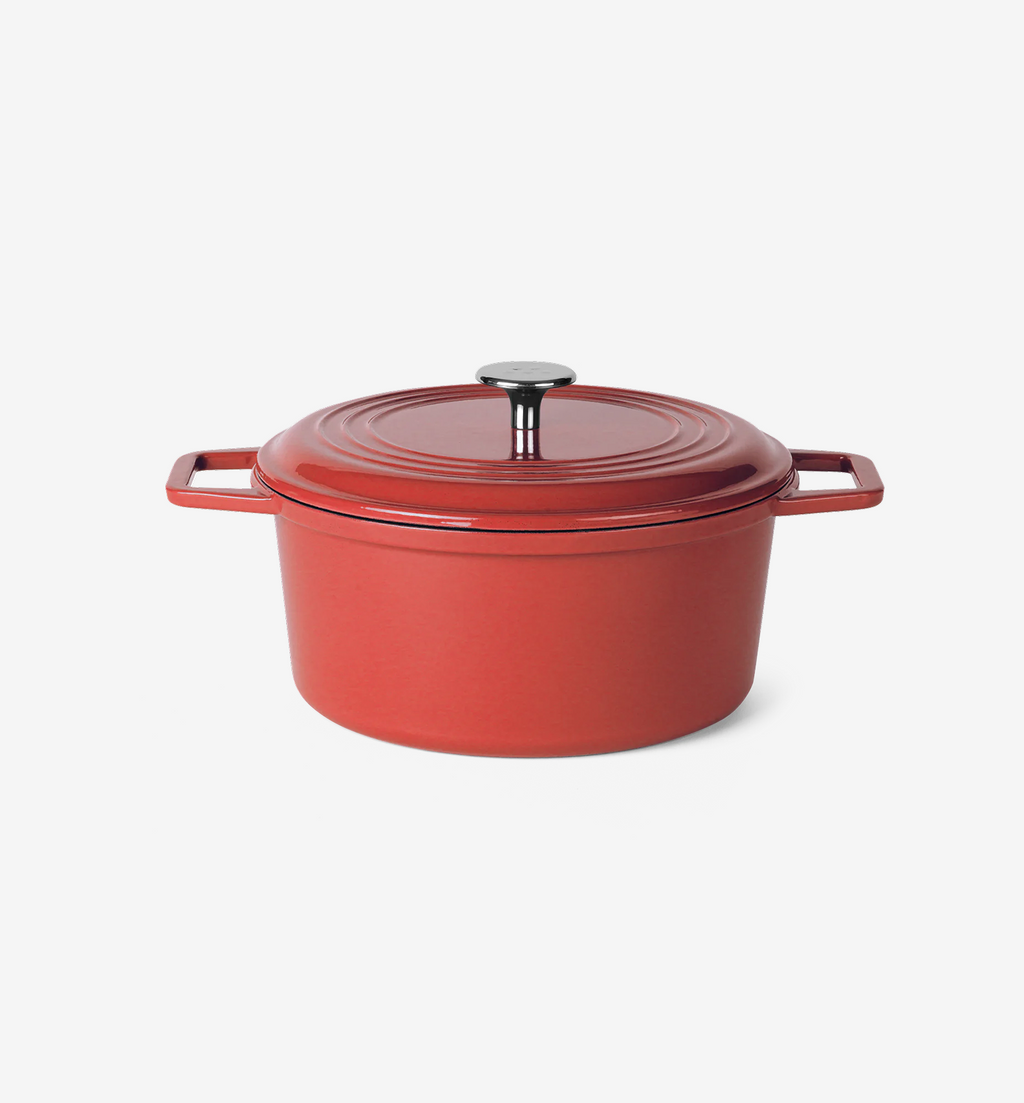 Red enameled cast iron Dutch oven with lid and stainless steel knob